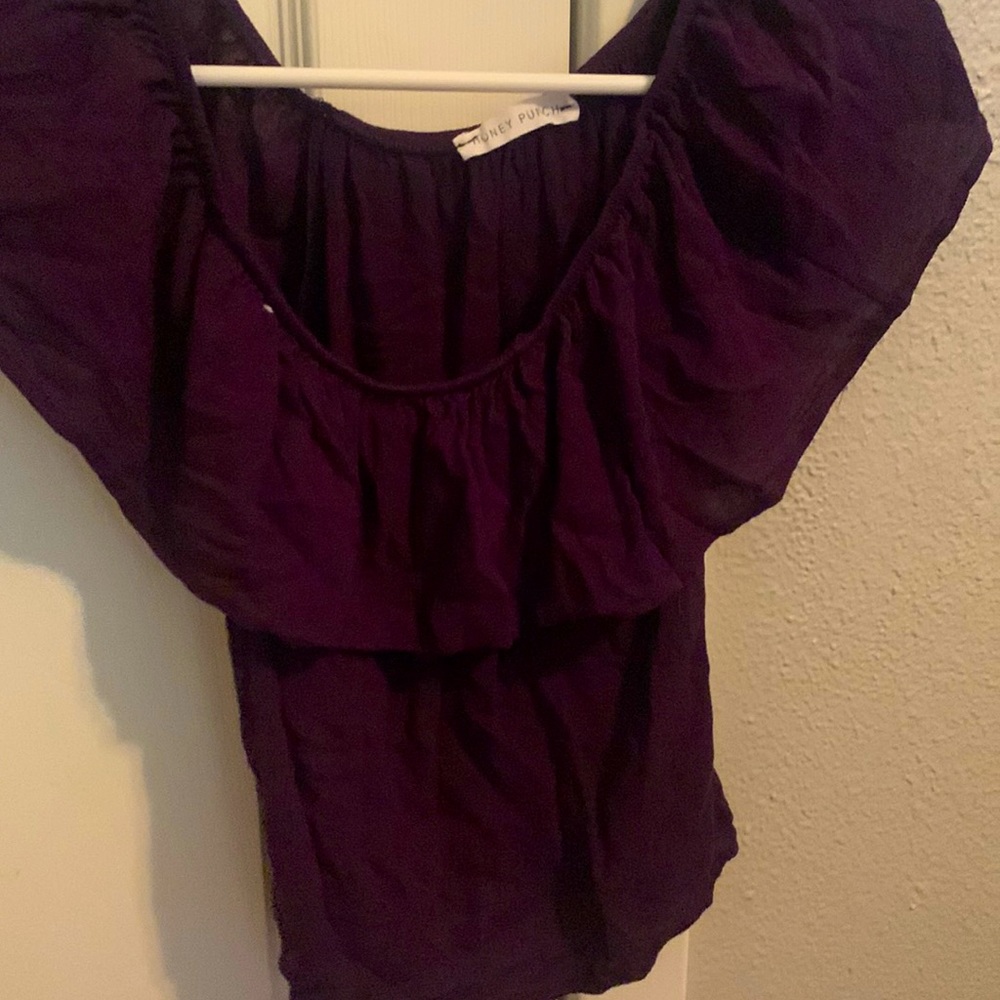 It is a purple top from honey punch